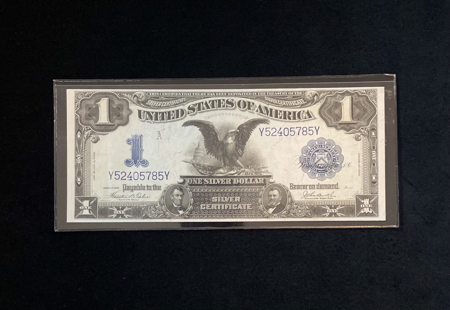 A picture of the back side of an old one dollar bill.