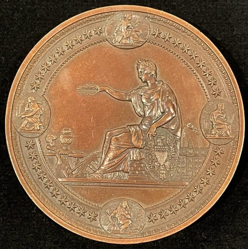 A bronze medal with an image of a man holding a sword.